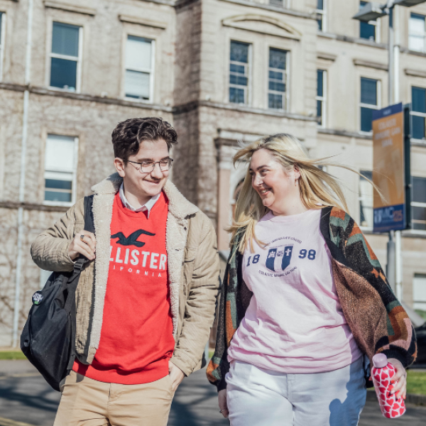 Two students outside the main building of MIC Limerick