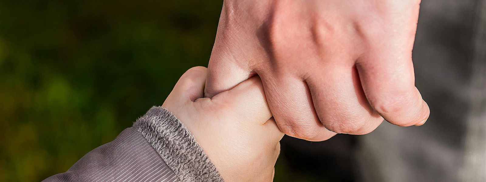 parent and child holding hands