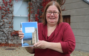 Dr Catherine Swift pictured with newly published book