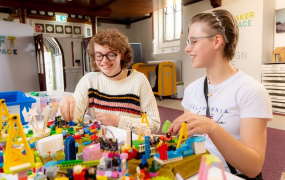 Two Girls Assembling a Lego city