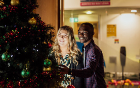 Postgraduate students at Christmas tree in MIC