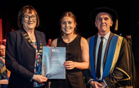 Rachel Mahony, awarded the Ashling Murphy Memorial Entrance Scholarship for 2024 with Anne Horan, Vice-President of the INTO and Professor Dermot Nestor, President of MIC