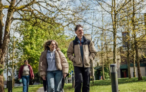 Female and male MIC students walking through MIC Limerick campus