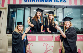 Four girls graduating having ice cream