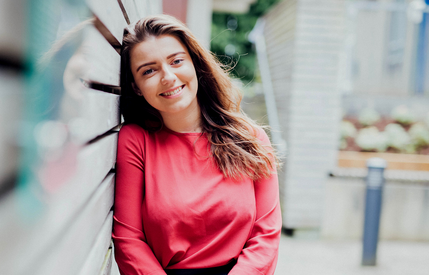 Girl with brown hair standing outside on MIC's Limerick campus