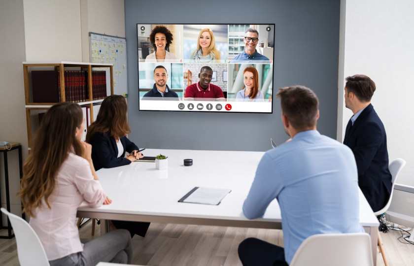 Office workers looking at a virtual meeting screen