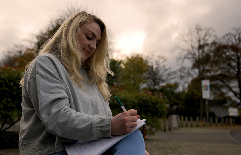 student on MA in Modern English Literature outside TARA building in MIC Limerick