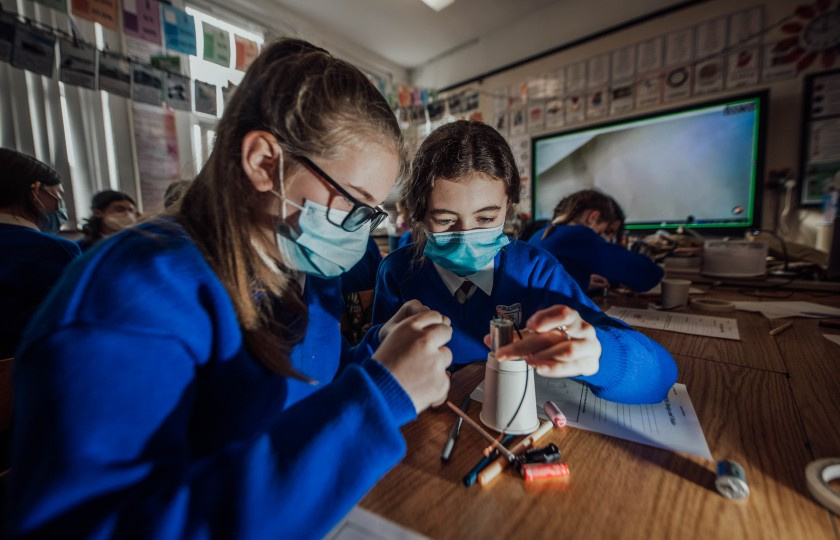 Two female students partaking in science experiment