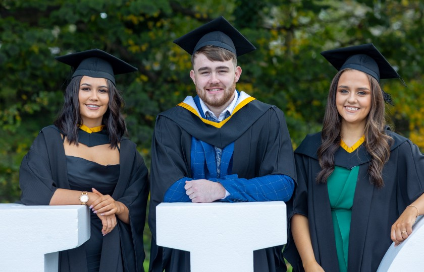 Three students in gowns