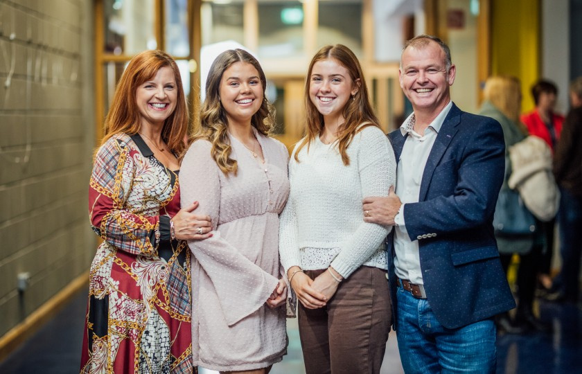 Student pictured with her family at the MIC College Awards 2022