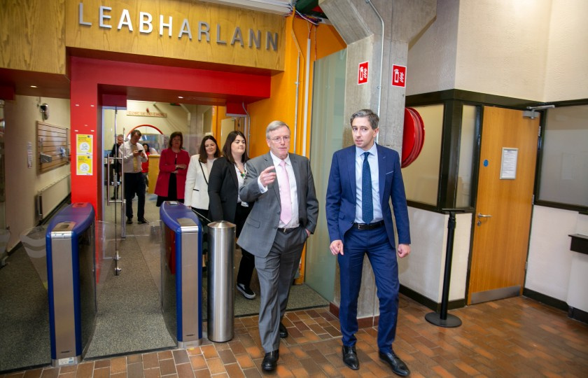 Minister Simon Harris exiting the MIC library building with Professor Eugene Wall.