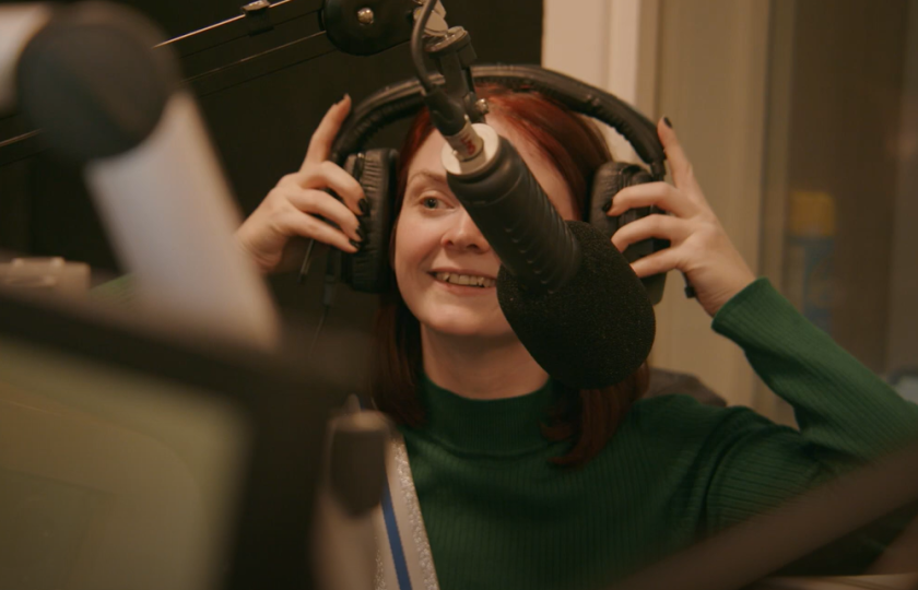 MIC media student sitting at production desk 