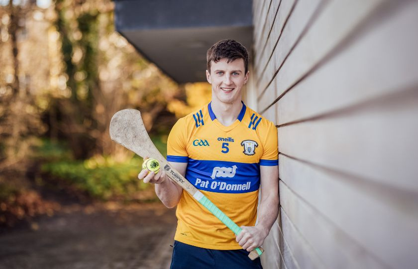 Diarmuid Ryan in a Clare jersey holding a hurley