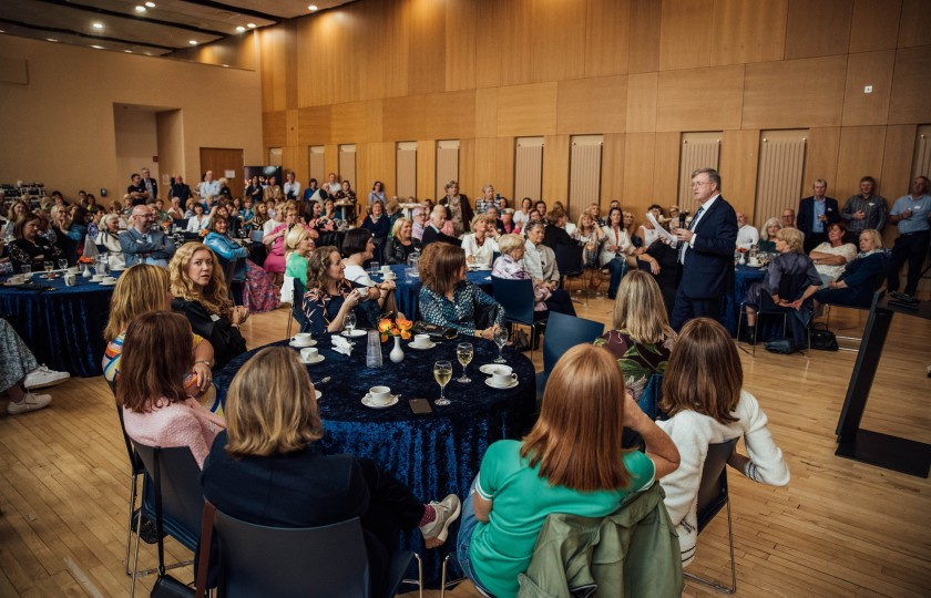 President of MIC, Prof Eugene Wall speaking to a crowded room of Alumni