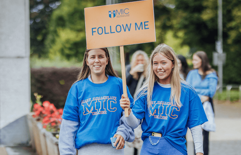 2 MIC Campus Ambassadors leading students on a tour of the college