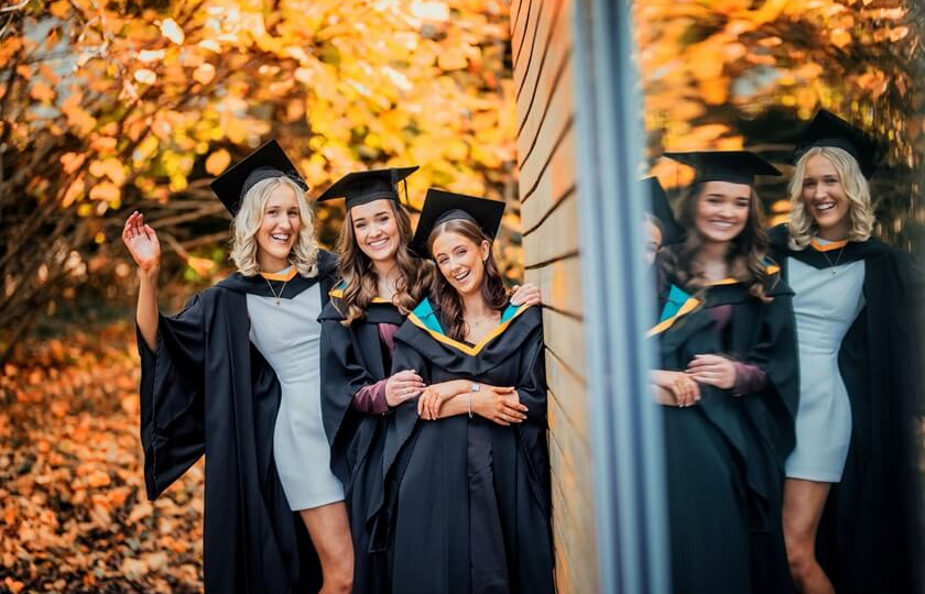 three female graduates at MIC Graduation 2024