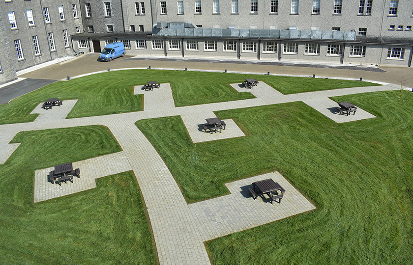 An aerial view of outdoor tables on the college green.