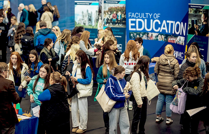 Students at MIC open day information stands
