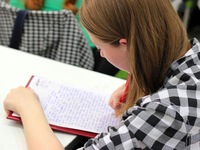 Young woman taking notes in an educational setting