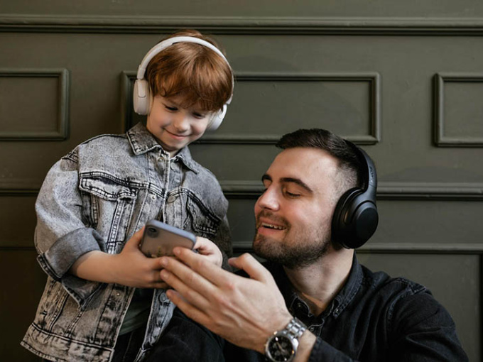 Parent and child looking at phone