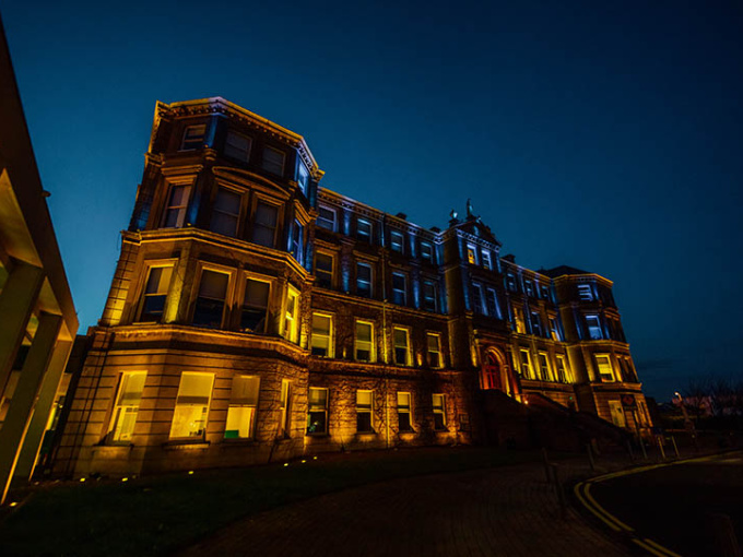 Mary Immaculate College Foundation Building at night.